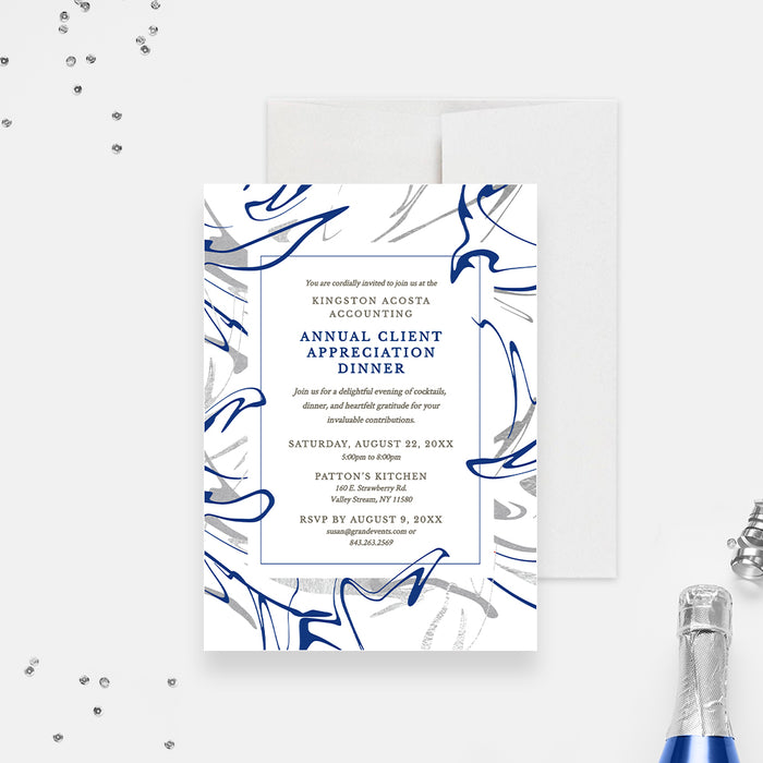 a blue and white wedding suite with a bottle of champagne
