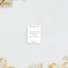 a white card with text on it, placed against a white background with a gift box and some flowers.