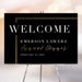a black and gold welcome sign for an event, specifically the Emerson Lawers Annual Dinner.