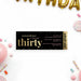 30th birthday ticket invitation with black background, gold-colored confetti, admit one header, and personalized adult birthday party details