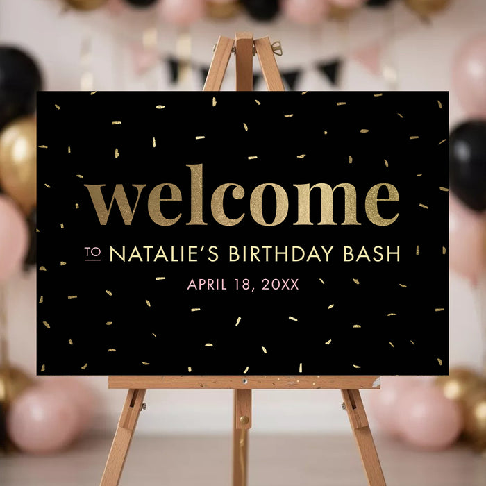 Personalized birthday welcome sign with black background, confetti accents, and custom party details in pink and gold displayed on an easel.