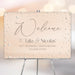 30th wedding anniversary welcome sign with pearl-inspired blush design, elegant script lettering, and personalized couple names displayed on an easel.