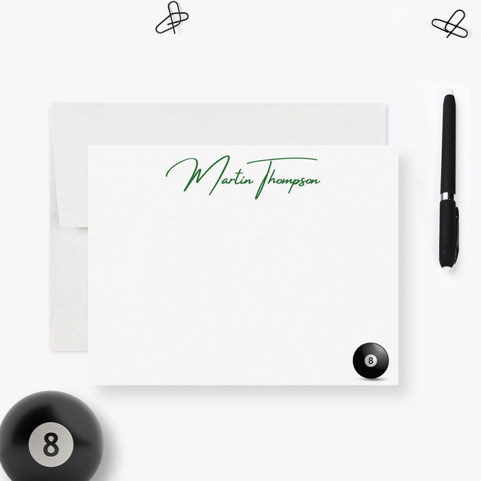 a personalized note card with the name "Martin Thompson" written on it, along with a pool ball and a pen.