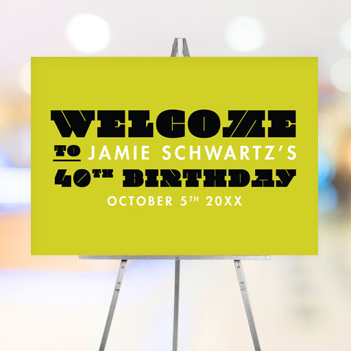 Bright yellow and black custom welcome sign on an easel, personalized for birthdays, weddings, and milestone celebrations.