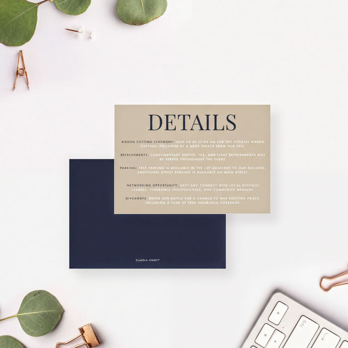 a card with details about an event, placed on a white background with some leaves and a keyboard in the foreground.