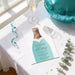 a birthday party invitation for a 30th celebration, with a champagne bottle design and a glass of white wine on a table.