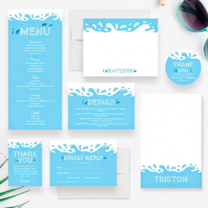 various blue and white items, including a menu, thank you cards, and envelopes, arranged on a white background.