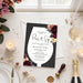 a black and white invitation card with a floral design, surrounded by various party items such as a candle, champagne glass, and a bottle of champagne.