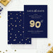 Navy 90th birthday save the date card with gold balloon artwork and a coordinating confetti back.