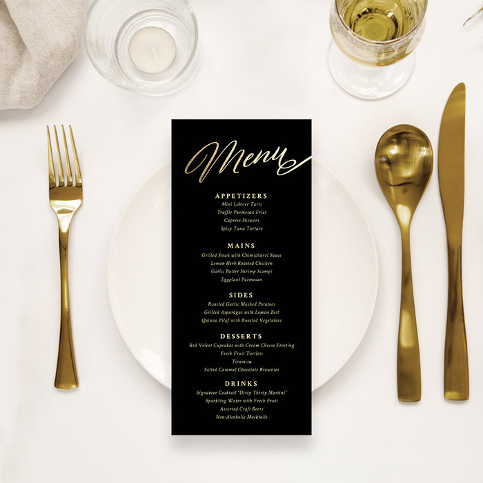 a table setting with a menu and gold utensils