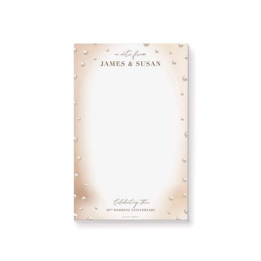 a notepad with pearls on it