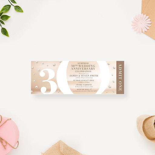 a white and gold 30th birthday party ticket invitation with pearls