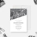 Personalized 50th birthday invitation with black and white bokeh design, large fiftieth script lettering, name, and party details-front