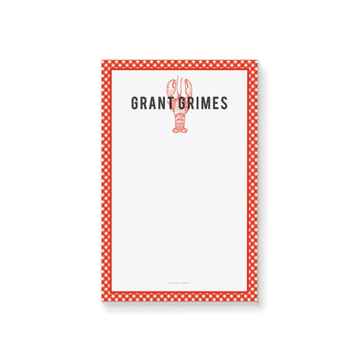 a crawfish notepad with a red and white a gingham pattern