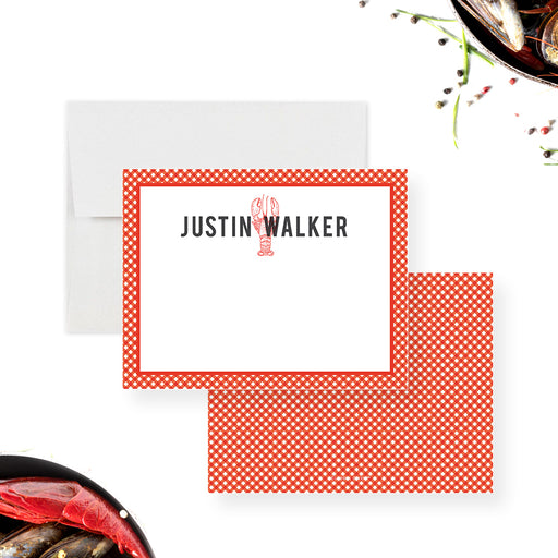 a red and white crawfish notecard with a gingham pattern
