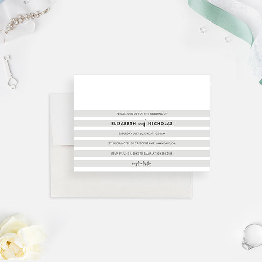 a white invitation card with a gray and white stripes on it