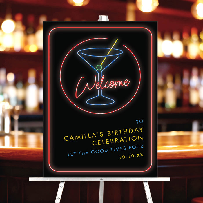 neon cocktail birthday welcome sign with glowing martini drink design displayed on easel in bar setting