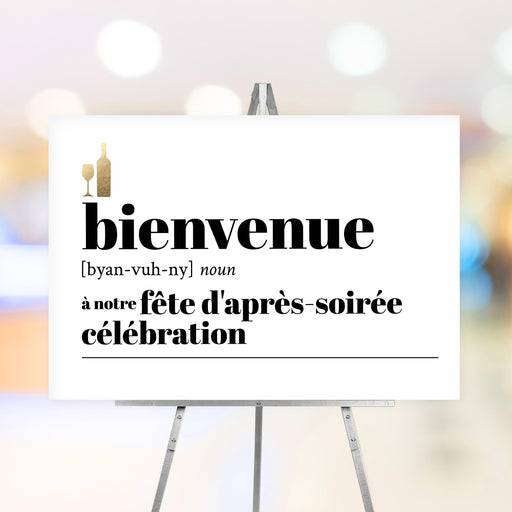 French après-holiday welcome sign with "Bienvenue" text, phonetic spelling, and gold wine bottle and glass icon on modern white background.
