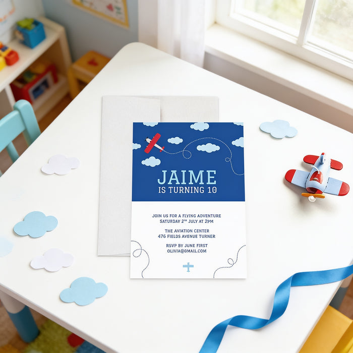 A birthday party invitation for a child named Jaine, featuring a blue background with a red airplane and clouds, and a small toy airplane on a white table.