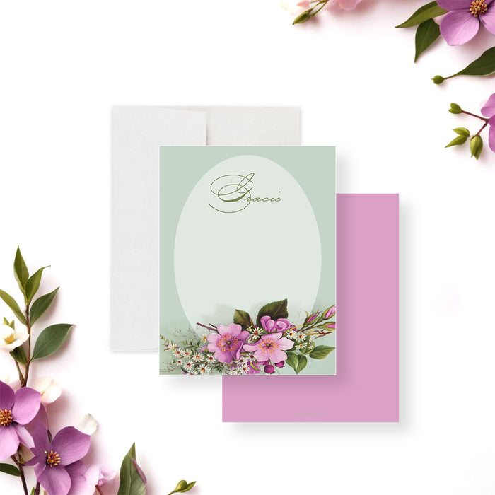 Personalized floral baby shower thank you card featuring pink and white blossoms on a sage green background, perfect for elegant stationery or a party favor.-front-back