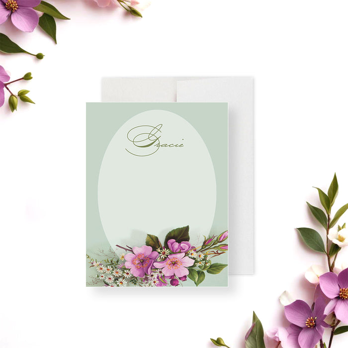 Personalized floral baby shower thank you card featuring pink and white blossoms on a sage green background, perfect for elegant stationery or a party favor.-front