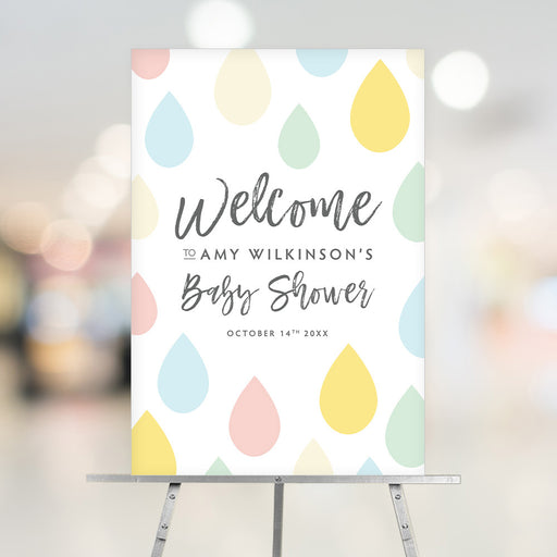 Colorful raindrops baby shower welcome sign for the mom-to-be, a cheerful party entrance decoration.