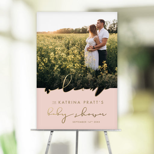 Create a stylish welcome for your baby shower with this personalized sign featuring a maternity photo and gold script. Customize it with your event details!