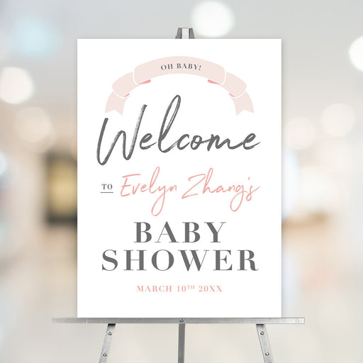 Personalized blush pink welcome sign with “Oh Baby!” ribbon banner, customizable for baby shower celebrations.