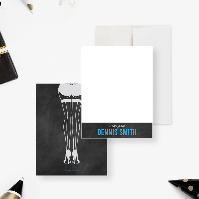 Personalized bachelor party note cards with a white writing front, blue name lettering and stocking clad legs illustrated on a black chalkboard reverse.