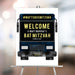 Bar mitzvah welcome sign featuring a party bus design with bold lettering displayed on an easel at event entrance