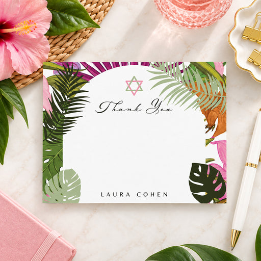 Tropical Bat Mitzvah thank you card featuring a palm leaf and floral border, Star of David, and personalized name in an elegant design.-front