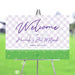 Bat Mitzvah welcome sign with purple check pattern and garden design displayed on an easel for event entrance decor