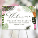 Bat Mitzvah welcome sign with tropical leaf design on a stand.