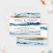 beach destination wedding invitation with blue ocean wave artwork, sand-toned accents, monogram, and coastal wedding details-front-back