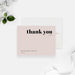 Beige wedding thank you cards with bold black thank you lettering and personalized names on the front and a plain beige reverse.