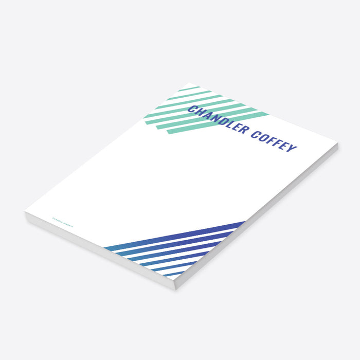 Personalized notepad featuring teal and navy diagonal stripes, with a custom name in bold navy text, designed in a modern stationery style.-side