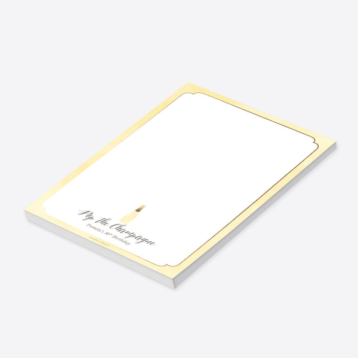 Elegant “Pop the Champagne” personalized notepad featuring a champagne bottle design, a perfect stationery souvenir for 30th, 40th, and 50th birthdays.-side