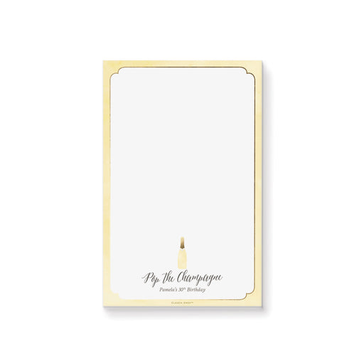 Elegant “Pop the Champagne” personalized notepad featuring a champagne bottle design, a perfect stationery souvenir for 30th, 40th, and 50th birthdays.