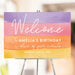 Pastel watercolor birthday welcome sign personalized for kids party displayed on easel