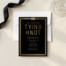 Black and gold engagement invitation flat lay