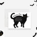 Halloween party invitation featuring a large black cat illustration with yellow eyes on a white background. The event details are written across the cat’s body in a playful font, surrounded by small black bat graphics, creating a fun and spooky theme.