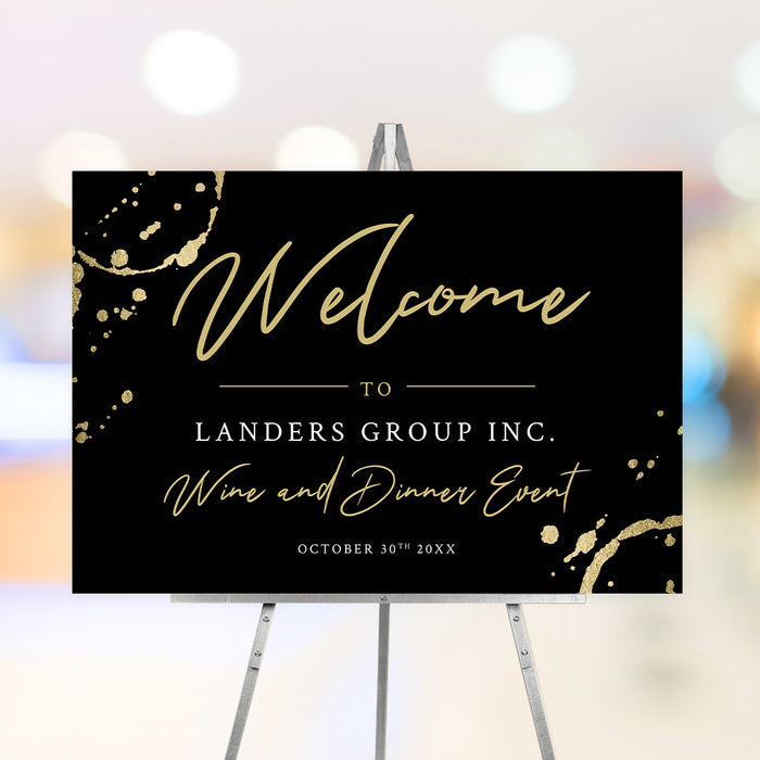 Black corporate wine dinner welcome sign with gold wine glass ring accents, script lettering, company name and event date