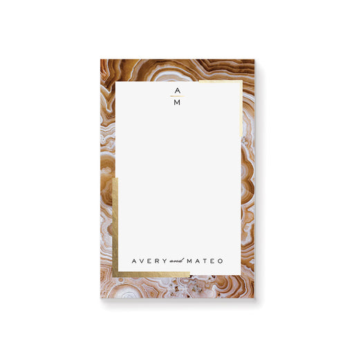 Personalized wedding notepad with a geode border design and custom couple names in a modern elegant stationery style
