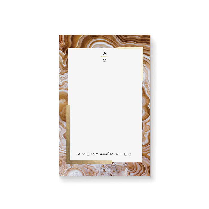 Personalized wedding notepad with a geode border design and custom couple names in a modern elegant stationery style