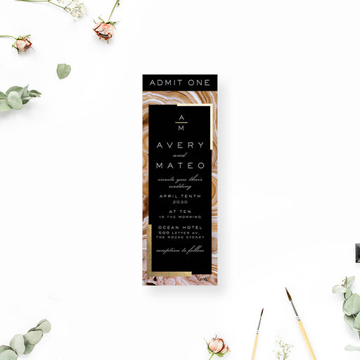 Geode wedding ticket invitation with a brown agate stone background and black and gold tones
