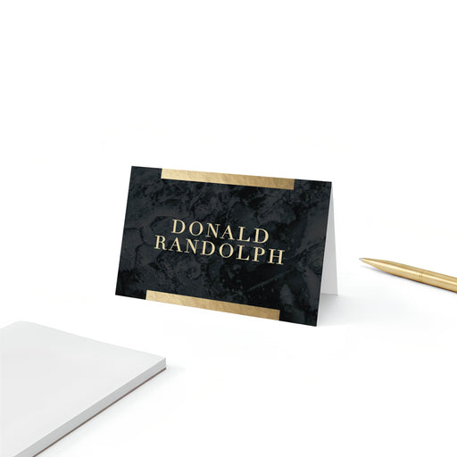 Personalized black marble place cards with gold accents folded into elegant tent name cards for weddings and formal events