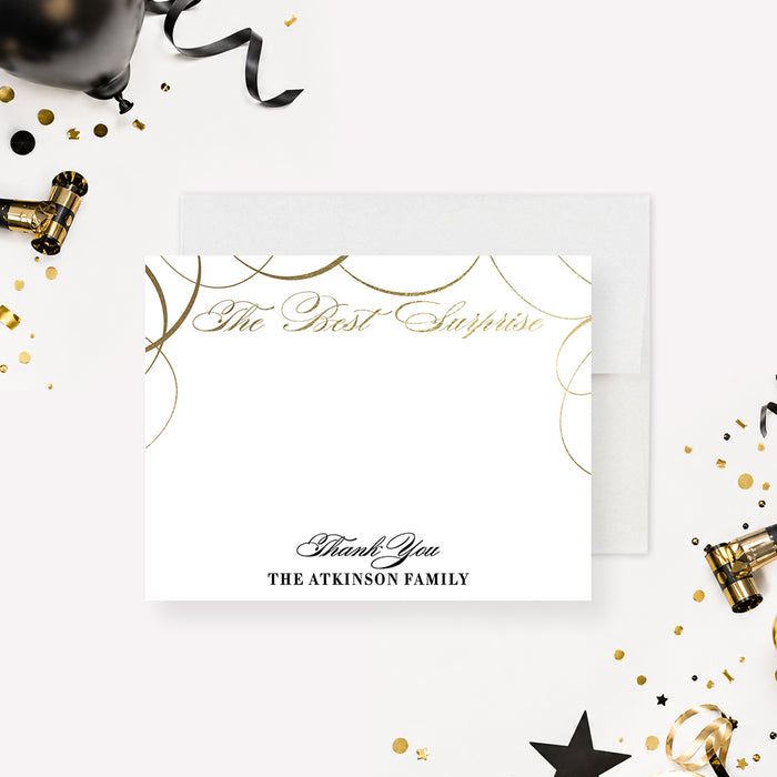 Personalized white thank-you card with gold swirl accents, “The Best Surprise” gold script, and custom family name.