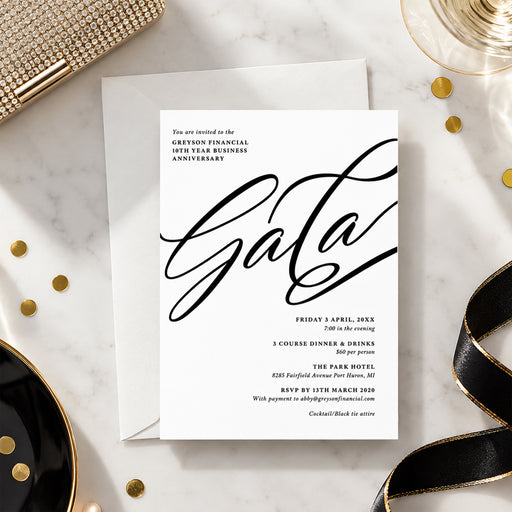 An elegant black and white corporate gala invitation template featuring large script lettering, gold accents, and details for a 10th business anniversary dinner.