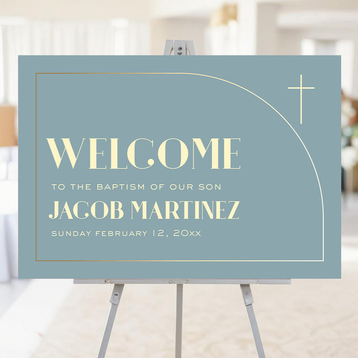 Blue baptism welcome sign with gold cross and modern arch design displayed on an easel for a christening or baby dedication celebration.