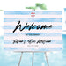 Blue Bar Mitzvah welcome sign featuring watercolor stripes with a pool party theme on a large entrance poster for a boy’s celebration